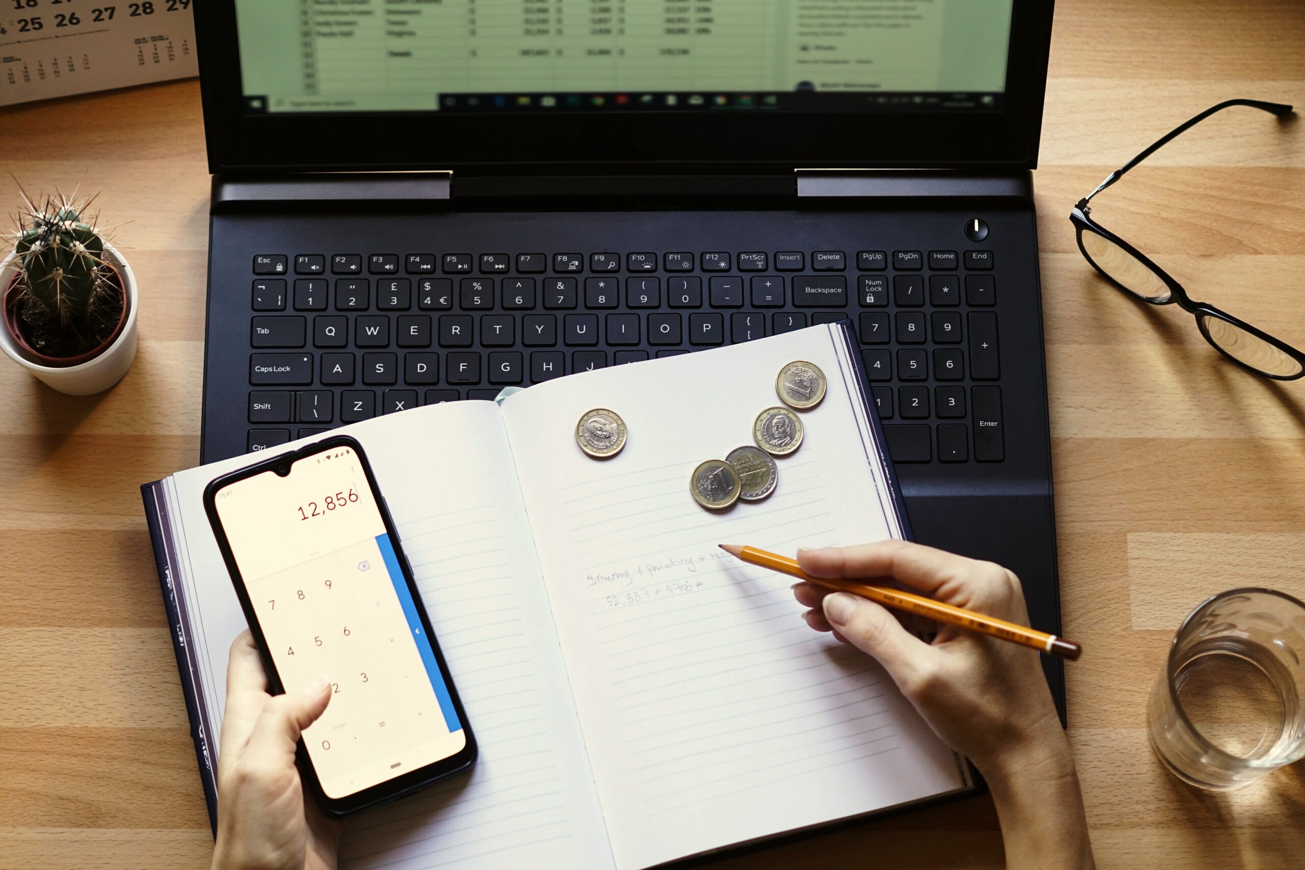 A closeup shot of an entrepreneur working from home on his personal finances and savings